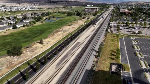 Drone View of Lehi Office Building with Solar Panels and Train at Lehi Station Stock Footage 340564873