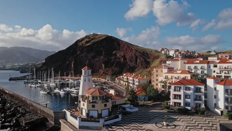 Drone view of the lighthouse on the coast of Madeira in the golden hour Stock Footage 304507400