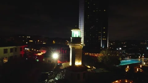 Drone View of a Lighthouse Shining Bright in Istanbul Night Stock Footage 314306931