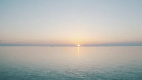 Drone view of the lighthouse in the trees, the white lighthouse building built Stock Footage 234098446