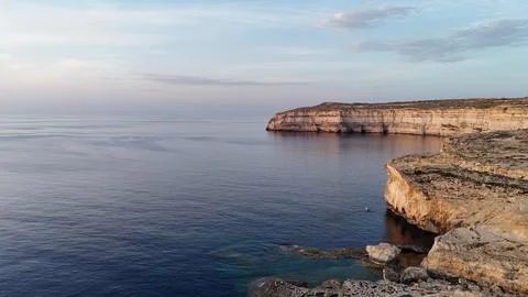 Drone View of Limestone Cliffs and Tranquil Sea on Gozo Island, Malta Stock Photos