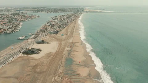 Drone view of Long Beach coastline with sand berms protecting homes  Видео 347621404