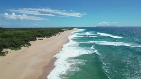 Drone view of a long sandy beach with turquoise surf in Hawaii 動画素材 348263757