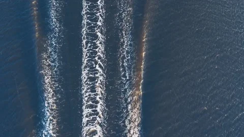 Drone view of long waves left by luxury boat in blue sea Stock Footage 160988456