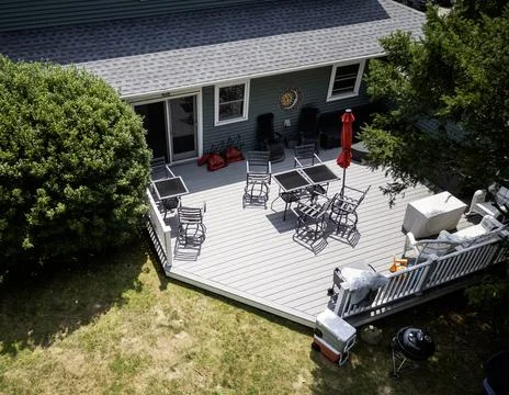 Drone view looking down at a deck on the back of a house Stock Photos