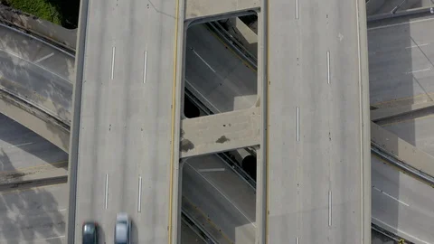 Drone view of Los Angeles freeway merger with Light Traffic during Covid Stock Footage 128220471