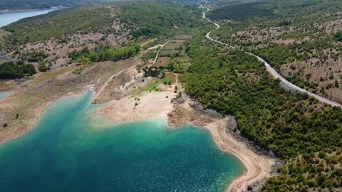 Drone view on low water level in huge lake. Road along the lake Video stock 231393501