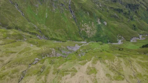 Drone View: Lush Green Austrian Alps with Serene Mountain River Flowing Thr.. Stock Footage 318971794