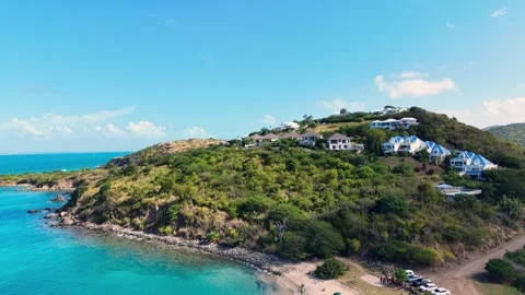 Drone view of luxury villas on the hillside overlooking the blue sea.  動画素材 336344607