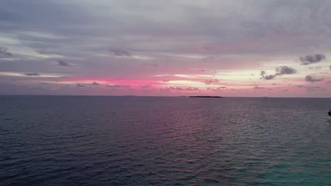 Drone view of Maldives sunset over dark blue ocean and violet sky in evening 스톡 동영상 165696569