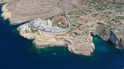 Drone view of Malta's Blue Grotto sea arch and cliffs over turquoise water Stock Footage 337001900