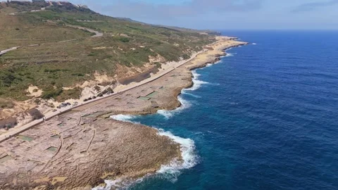 Drone view of Maltese salt pans at Xwejni forming patterns along the rocky shore Stock Footage 335836742