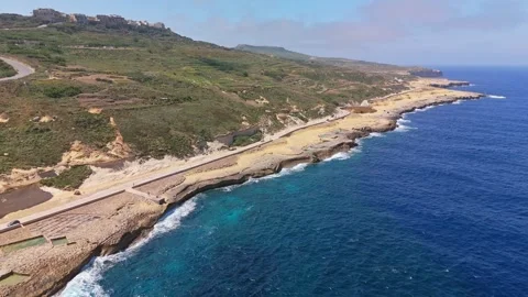 Drone view of Maltese salt pans forming geometric patterns along the coast Stock Footage 335836791
