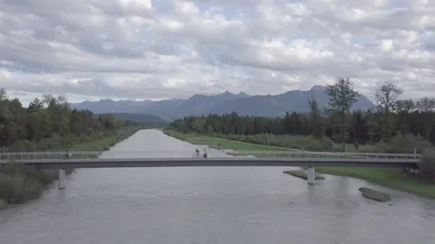 Drone View Of Man On Bicycle Riding On Bridge Stock Footage 264269602