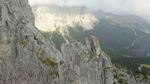 Drone view of man standing on mountain ridge in 4k. Stock Footage 143373833