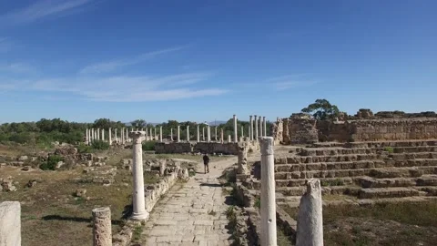 Drone view of man walking through the Colonnaded Street of Salamis. DJI-0238-11 Stock Footage 137353371