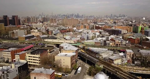 Drone view of Manhattan and Brooklyn from Bushwick - Subway tracks in the center Stock Footage