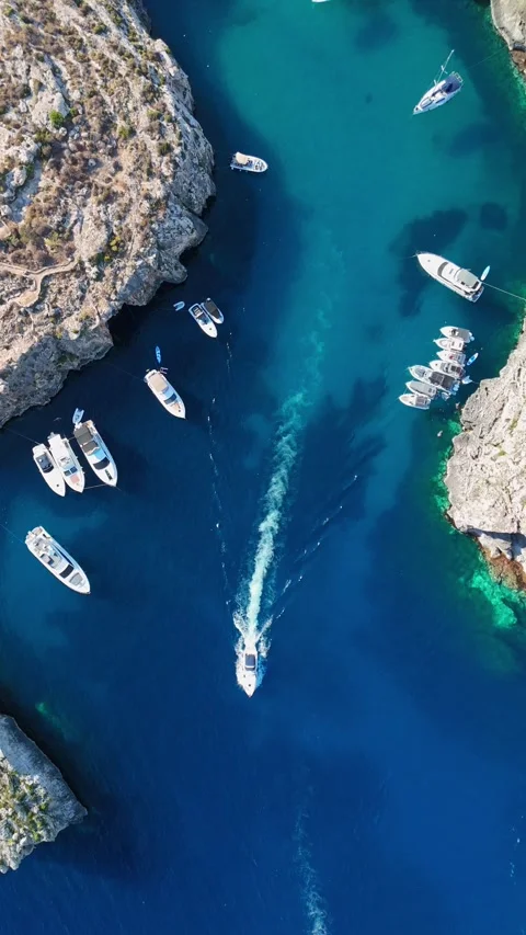 Drone view of Mġarr ix-Xini bay, Gozo, with boats in turquoise waters Stock Footage 341712495