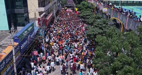 Drone view of Massive Crowd Dancing Joyfully During Vibrant Ganesha Immersi.. Stock Footage 340084111