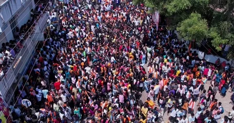 Drone view of Massive Crowd Dancing Joyfully During Vibrant Ganesha Immersi.. Stock Footage 340084154