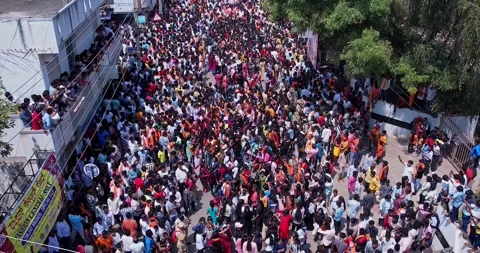 Drone view of Massive Crowd Dancing Joyfully During Vibrant Ganesha Immersi.. Stock Footage 340084161