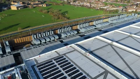 Drone view of massive industrial cooling arrays and HVAC systems for AI server Stock Footage 335226345