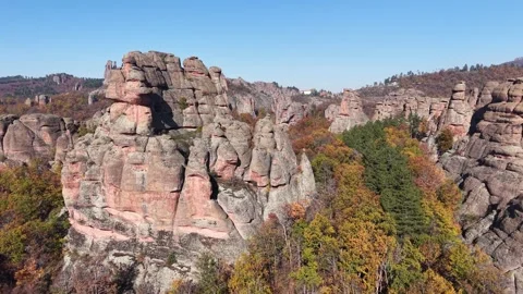 Drone View of Massive Rock Towers Above Forest Video stock 333180718