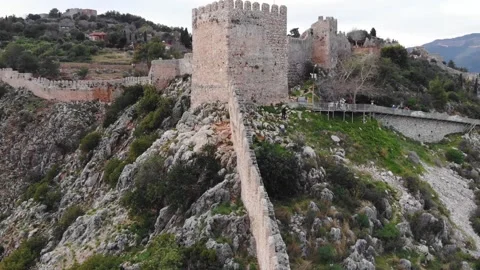 Drone View Of A Medieval Fortress Wall And Tower On A Mountain In Alanya, Turkey Stock Footage 195103582