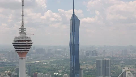 Drone view of Menara KL and Warisan Merdeka Tower in Kuala Lumpur, Malaysia Stock Footage 305655268