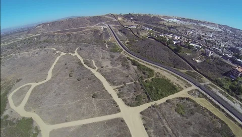 Drone view Mexico - US International Border Fence Wall in San Diego Stock Footage 101077891