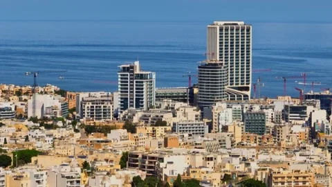 Drone view of modern highest building in Malta. Mercury tower and cranes Stock Footage 303483070