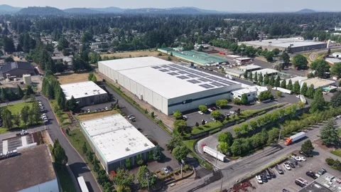 Drone view of modern industrial warehouse with solar roof in Gresham Stock Footage 341079777