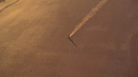 A Drone view of a motorcycle in the desert Stock Footage 264075439