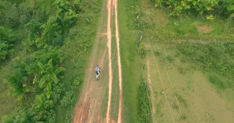 Drone view of a motorcycle riding Stock Footage 86194003