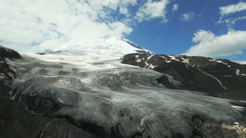 Drone view of Mount Elbrus flying over the rocks of Mount Cheget and Donguz 動画素材 232366270