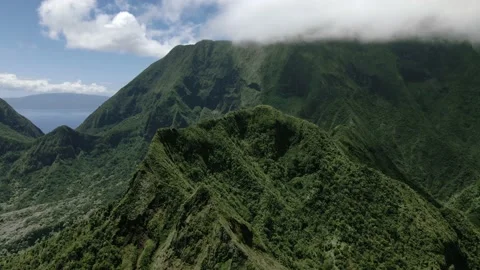 Drone view of mountain peaks covered with fog and clouds, Maui, Hawaii, USA Video stock 178218607