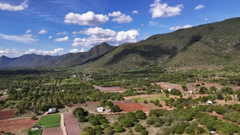 Drone View of Mountain Range and Farmland Under Blue Sky in Tamil Nadu Stock Footage 341555476