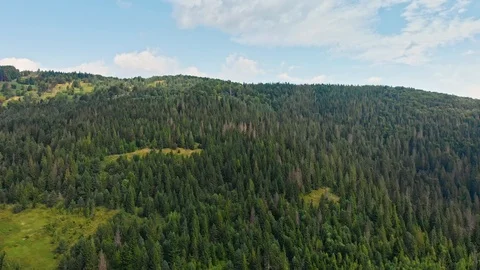 Drone view of mountain range, road, and forerst from above. Stock Footage 120276850