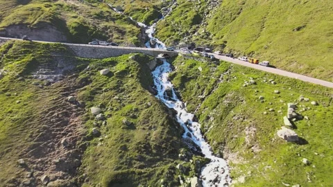 Drone View of Mountain Road Over River in the Swiss Alps Stock Footage 306667071