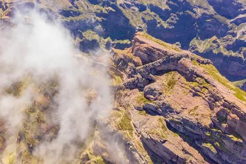 Drone view of mountain trail path submerged in fog Stock Photos