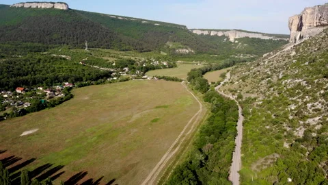 Drone view of a mountain valley and winding road. Stock Footage 157821427
