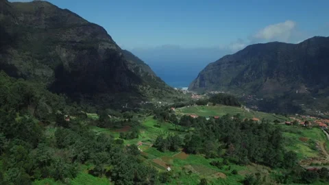 Drone view of the mountain valley landscape with houses with tiled roofs in Stock Footage 279313288
