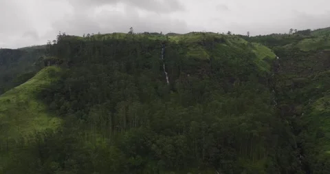 Drone View of Mountain Waterfall Surrounded by Tea Plantations Stock Footage 319304333