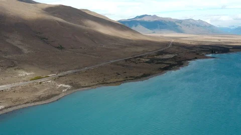Drone view of mountains and blue water lagoon near Perito Moreno in Patagonia Stock Footage 111831683