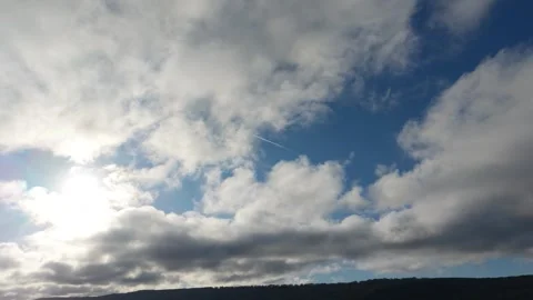 Drone View of Moving Clouds in Blue Sky Above Horizon Stock Footage 320930765
