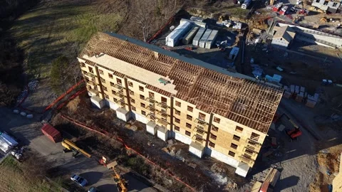 Drone View of Multi-Family Four-Story Condo Construction at Suburban Urban Edge Stock Footage 342653942