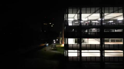 Drone view of a multi-level car park at night. Stock Footage 252554719