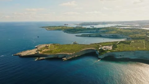 Drone view of Munxar Path, Maltese island. Green hills, rocks, cliffs and sea Stock-Footage 305923251