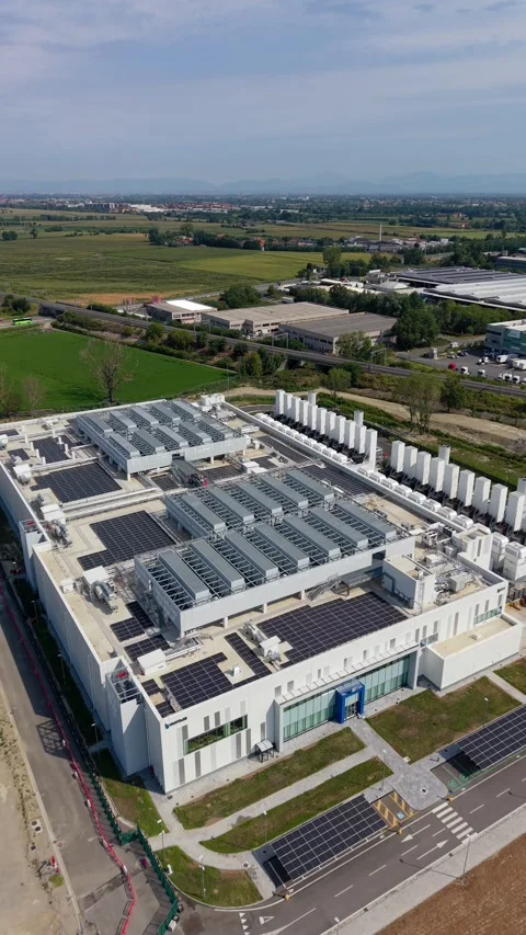 Drone view of the MXP1 data center in southeastern Milan, highlighting Stock Footage 344956844