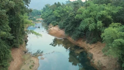 Drone view of Nam Hinboun river in Kong Lor, Laos Stock Footage 247383896